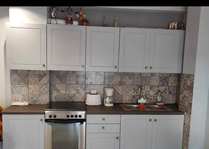 George * Λουτράκι